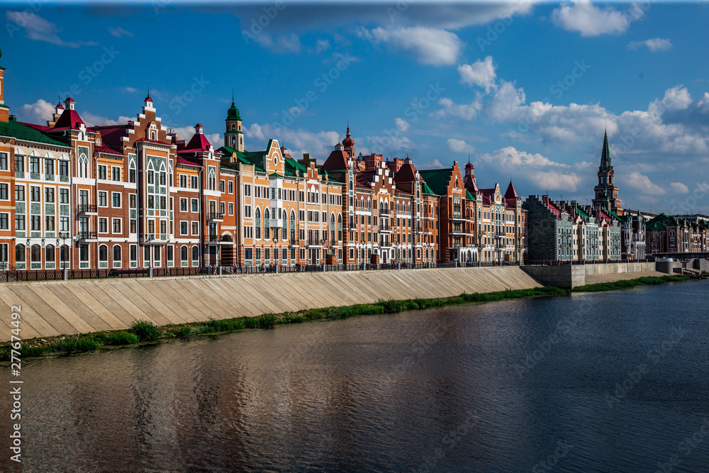 Naklejka premium beautiful houses in the Gothic style are located along the waterfront