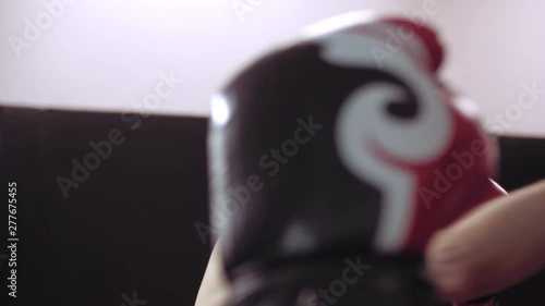 Young adult woman doing kickboxing training with her coach. photo