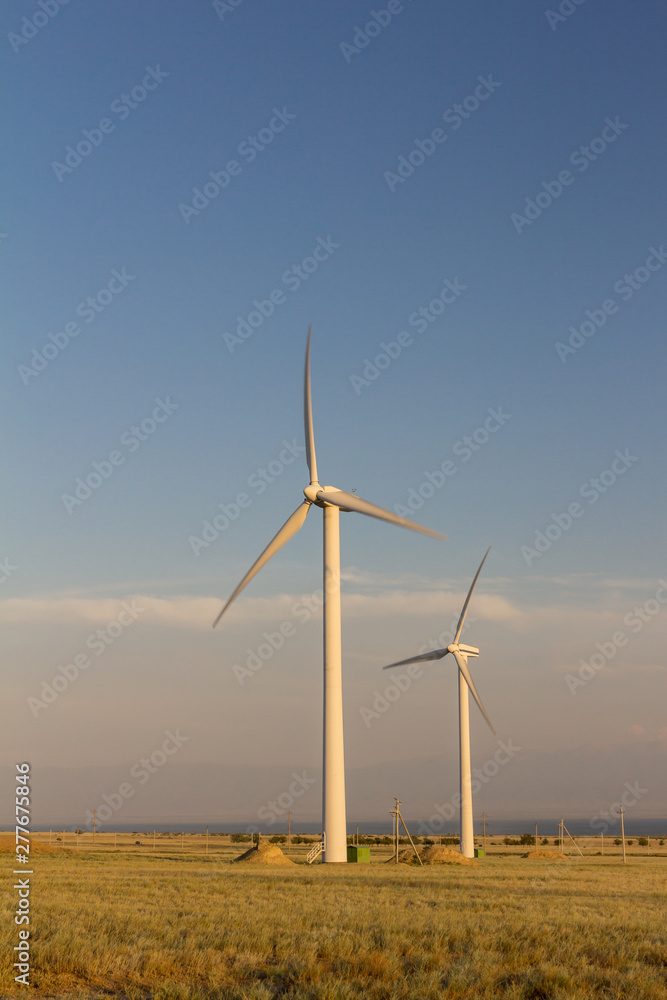 Group of wind generators in the steppes of Kazakhstan. (Kapshagay area) Group of wind generators in the steppes of Kazakhstan. (Kapshagay area)