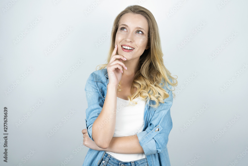 beautiful young woman holding hand near her chin close up isolated white background beautiful young woman holding hand near her chin close up isolated white background