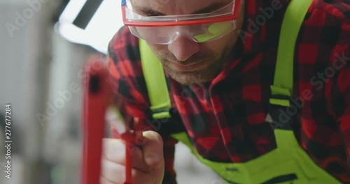 Carpenter working in his carpentry shop photo