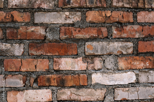 Red old worn brick wall texture background. Vintage effect