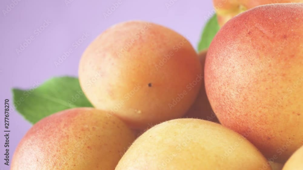 Composition of ripe fresh fruit. Environmentally friendly and delicious food. Light isolated purple background.