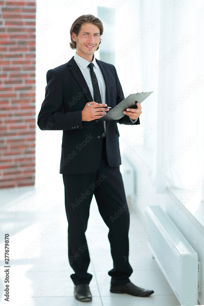 businessman with business document standing in office businessman with business document standing in office