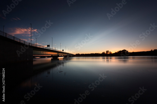 Blue hour at the Loughor estuary Sunset and high tide at the bridge over the Loughor estuary linking Swansea to Llanelli in South Wales, UK