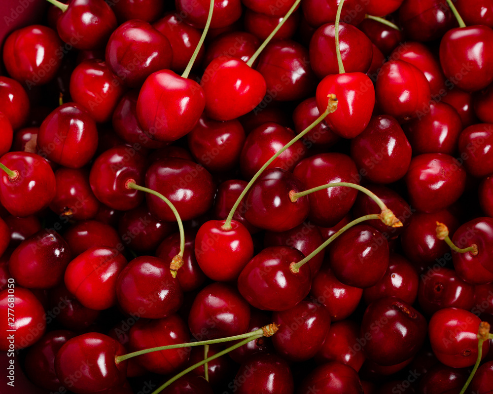 Fresh red ripe cherries with cuttings and leaves, abundant background Large collection of fresh red cherries Fresh red ripe cherries with cuttings and leaves, abundant background Large collection of fresh red cherries