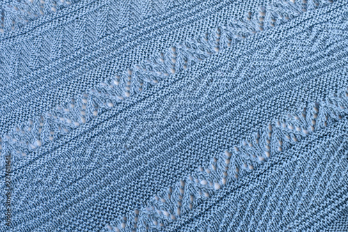 Knitting diagonal and horizontal patterns of natural wool blue