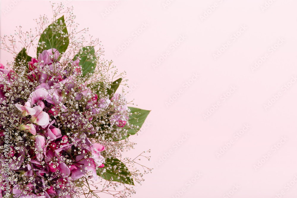 Pastel colors wedding bouquet made of sweet pea flowers isolated on pink background Pastel colors wedding bouquet made of sweet pea flowers isolated on pink background