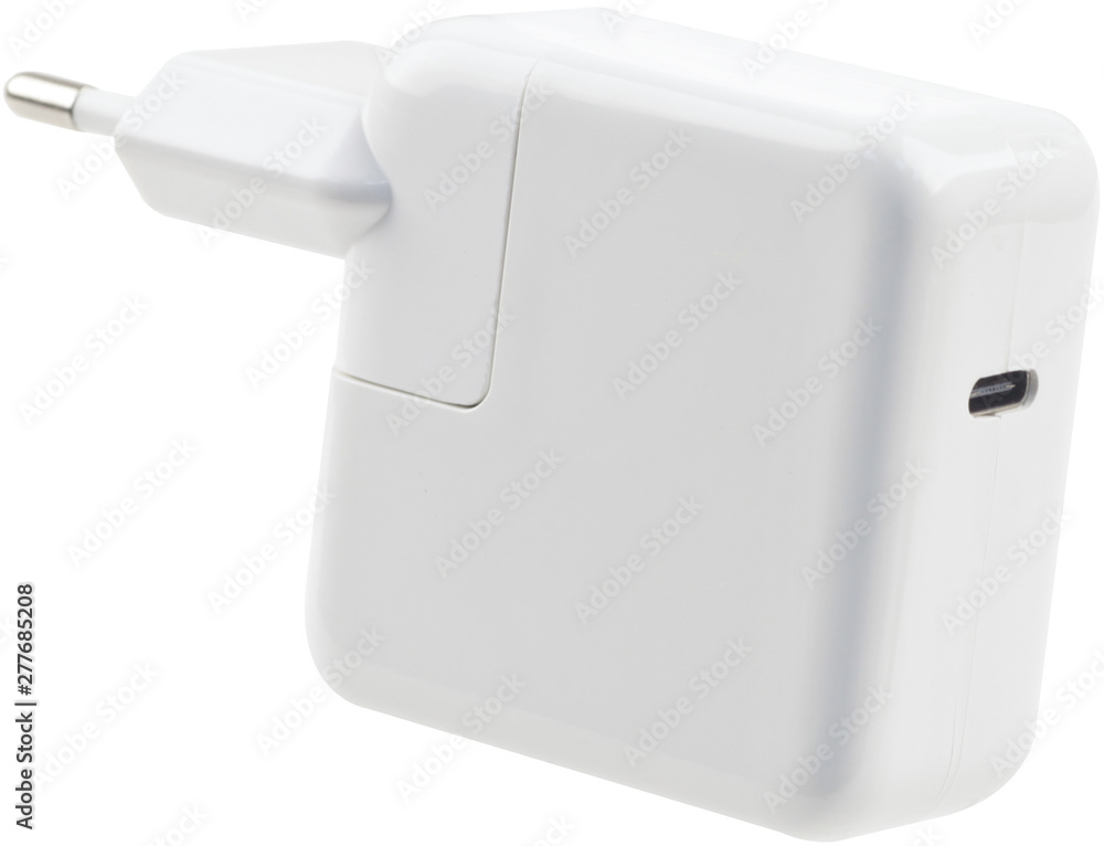 White charging power supply for smartphones isolated on white background. White charging power supply for smartphones isolated on white background.