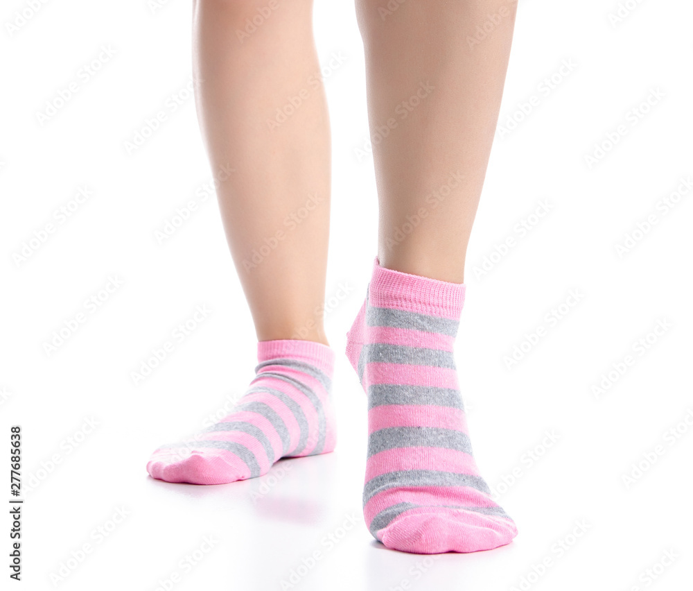Female legs with pink socks fashion on background isolation Female legs with pink socks fashion on background isolation