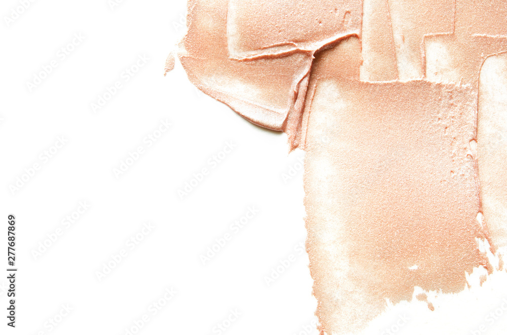Beige smears of crushed highlighter or luminizer. - Image Beige smears of crushed highlighter or luminizer. - Image
