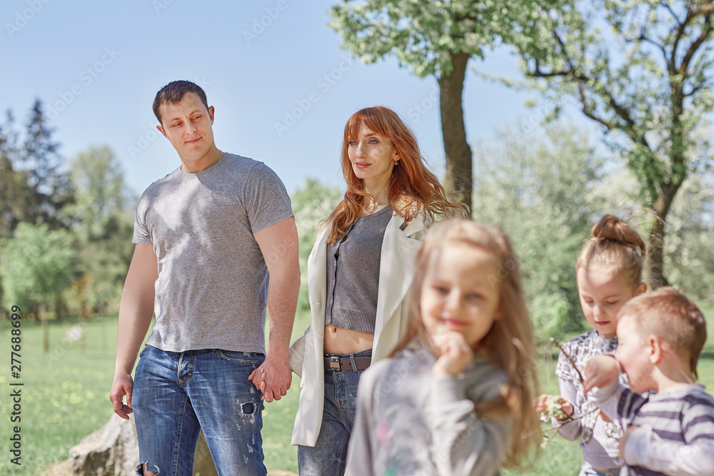 happy parents with children on a walk in the Park. happy parents with children on a walk in the Park.
