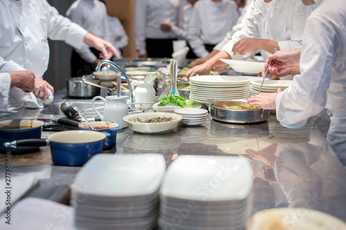 restaurant team chef working together in commercial kitchen