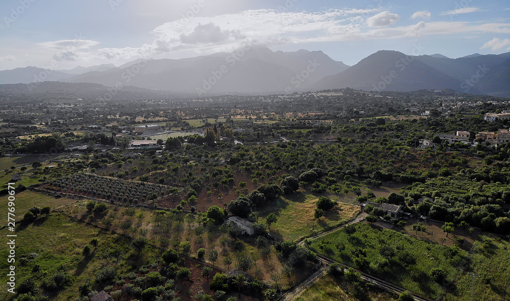 Aerial photo Campanet town situated in the northeast of Palma de Majorca, agricultural fields and meadows countryside rural scene, Balearic Islands, Spain Aerial photo Campanet town situated in the northeast of Palma de Majorca, agricultural fields and meadows countryside rural scene, Balearic Islands, Spain