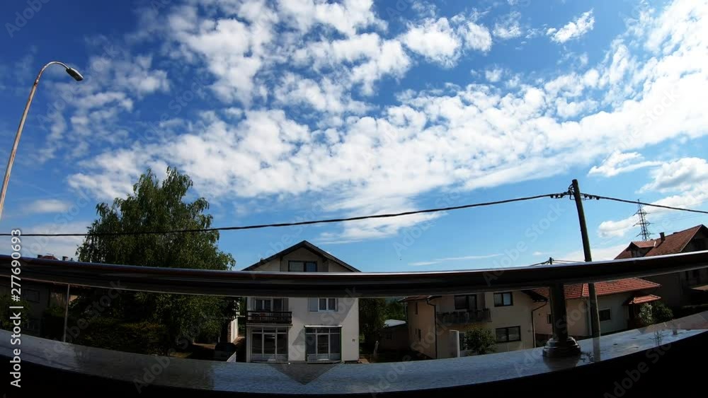 Balcony View Of Blue Skies And Houses In Bihac Time Lapse