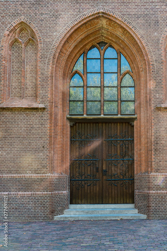 wooden doors of Sint Nicolaasbasiliek, Sint Nicolaas Basilica. Church in IJsselstein, The Netherlands  photo