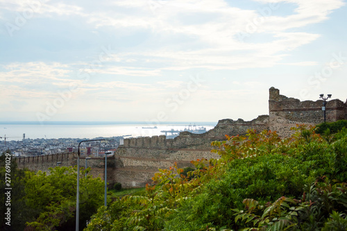 View of the sea and the fortress walls of the Trigonion tower in the Ano Poli -  Upper Town in Thessaloniki, Greece. photo