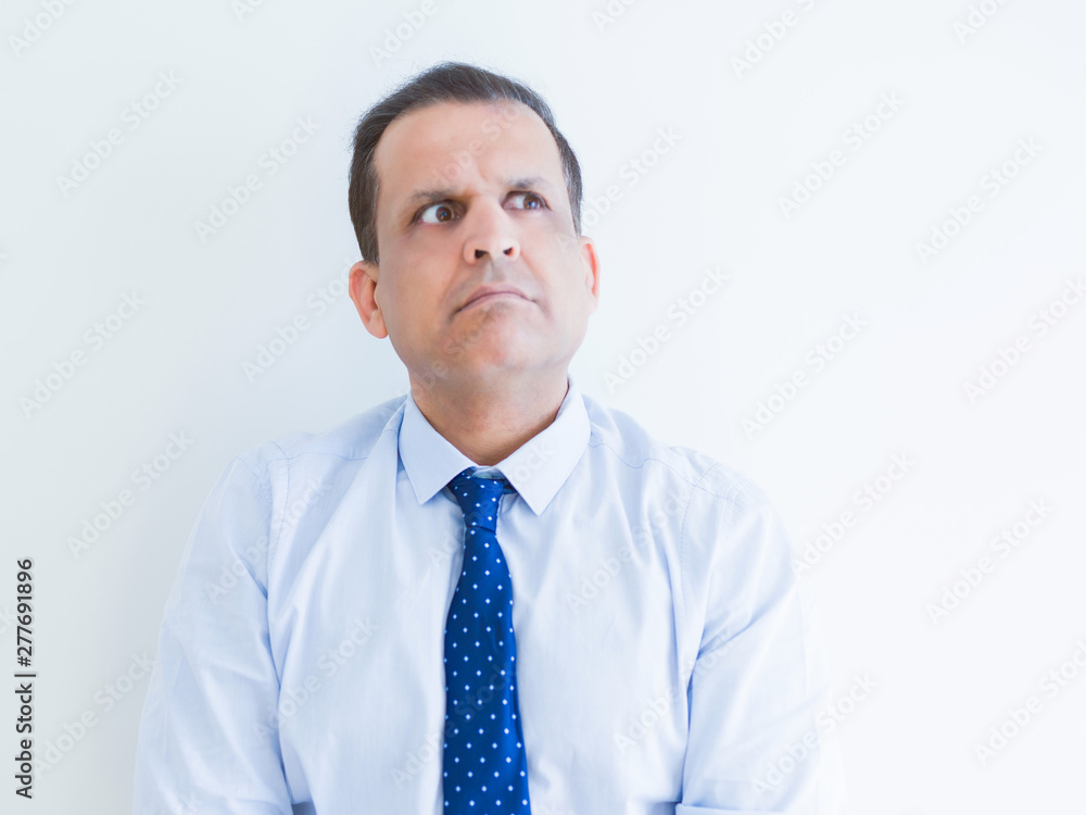Middle age man thinking clueless about a question Middle age man thinking clueless about a question