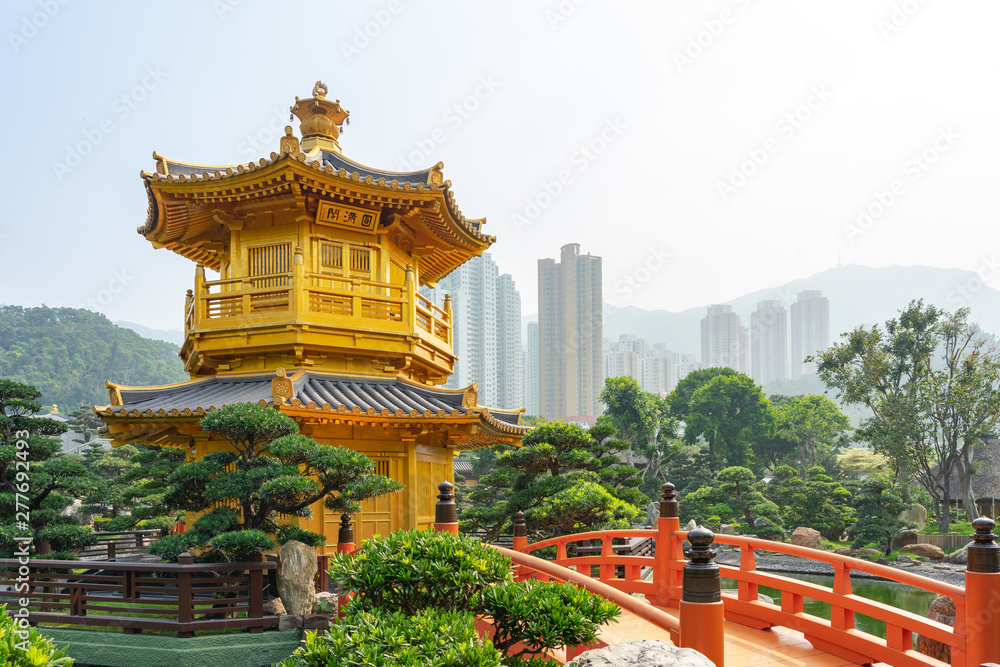 Fototapeta premium The Golden pavilion and gold bridge in Nan Lian Garden near Chi Lin Nunnery. A public chinese classical park in Diamond Hill, Kowloon in Hong Kong city