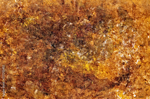 Creative multi color painted background. Close-up fragment of acrylic painting on canvas with brush strokes. Mix of yellow ochre and burnt sienna colors.