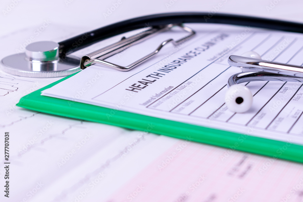 Health insurance and medical, Health insurance form, Medical stethoscope, cardiogram chart. for health planning concept. World Heart Day. Health insurance and medical, Health insurance form, Medical stethoscope, cardiogram chart. for health planning concept. World Heart Day.