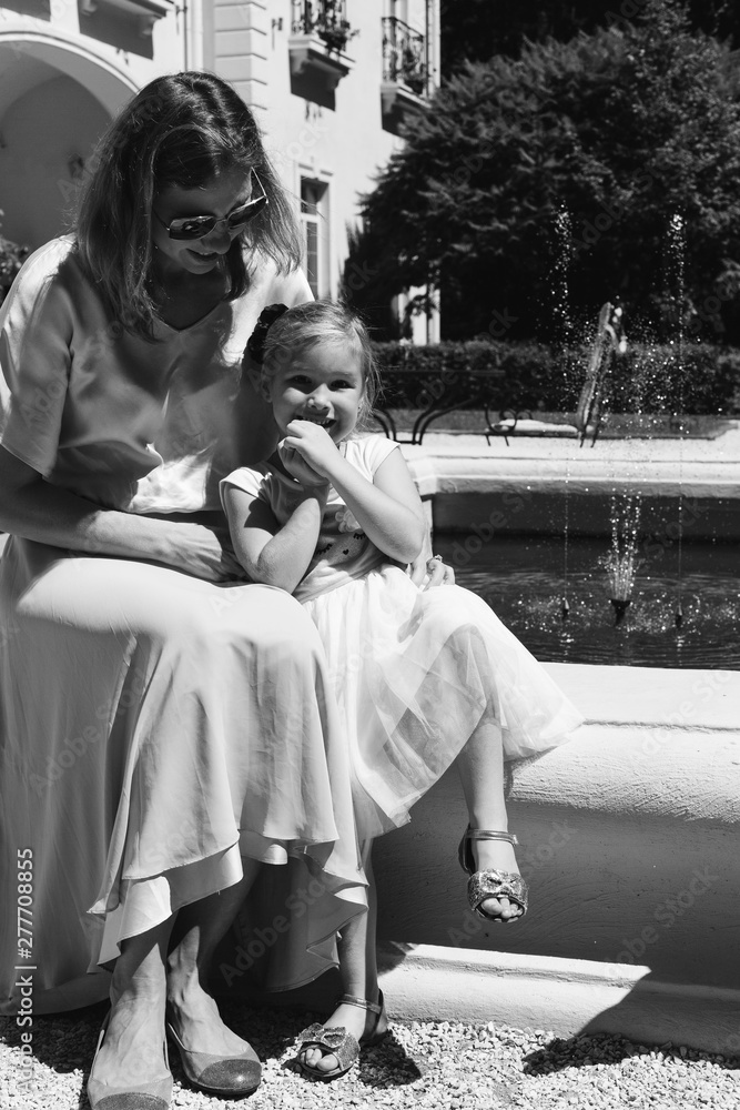 Obraz premium Happy mother and daughter monochrome outdoor portrait 