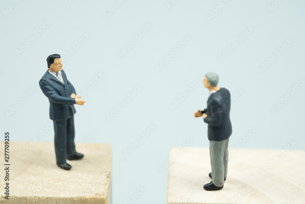 Miniature people businessmen talk invest contract agreement Miniature people businessmen talk invest contract agreement