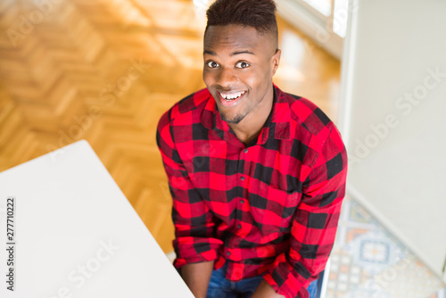 Handsome african young man smiling confident with big smile on face