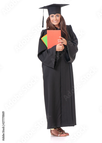 Full length portrait of young graduate girl student in mantle with colorful books. Teen girl isolated on white background