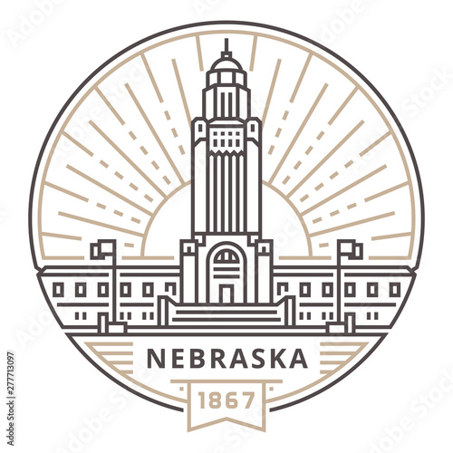Linear Nebraska State Capitol against the background of the sun in the form of an emblem