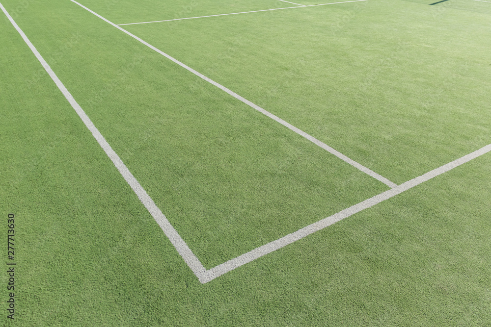 Obraz premium Part of the tennis court with markup. Artificial surface green sports field.