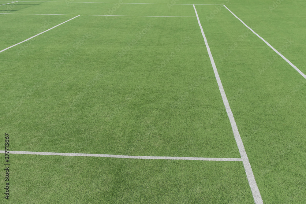 Part of the tennis court with markup. Artificial surface green sports field.