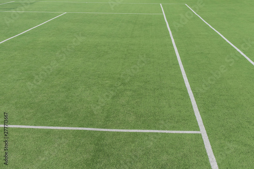 Part of the tennis court with markup. Artificial surface green sports field. © SlavoArtist