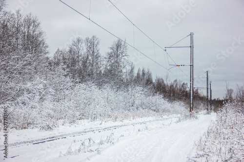 Rails and power line in the snow