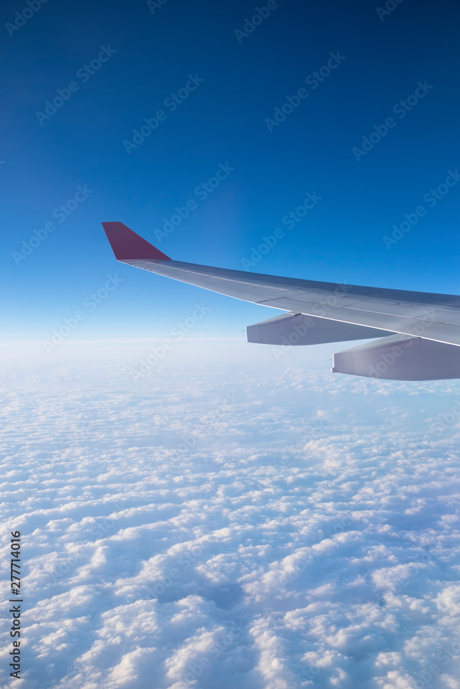 View from a plane window above the cloud. View from a plane window above the cloud.