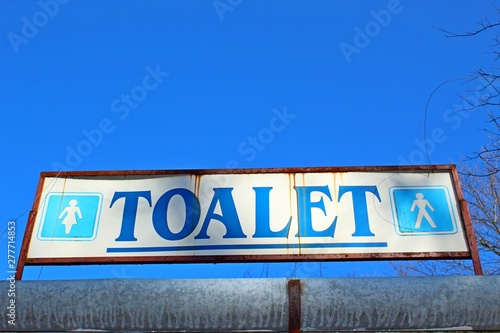Old toalet sign with frame
