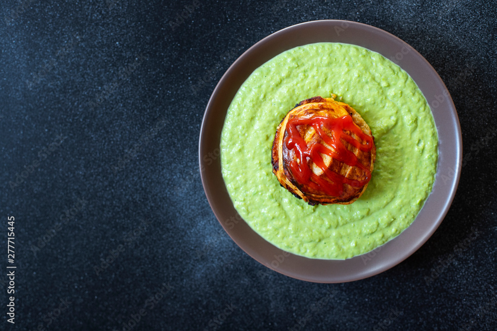 Traditional Australian dish called Pie Floater. Green pea soup served