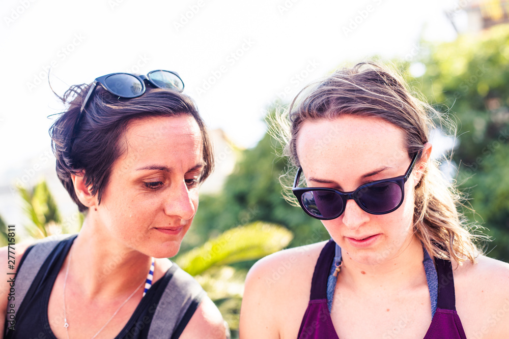 Lifestyle photography. Two happy and urban lesbian girlfriends in a sunny day in summer Lifestyle photography. Two happy and urban lesbian girlfriends in a sunny day in summer