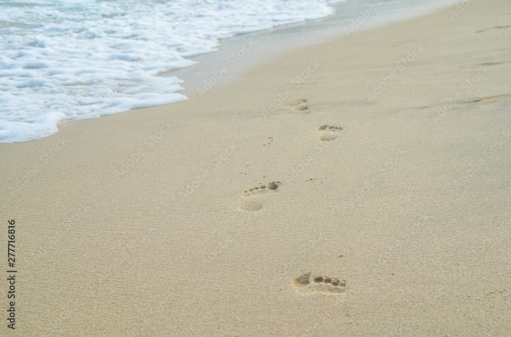 Footprints on the sand on the beach Footprints on the sand on the beach