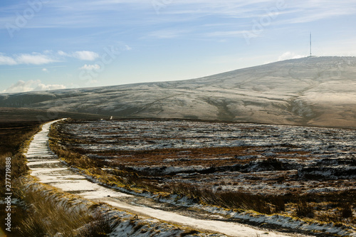 Frozen mountain road leading towards the transmitter mast on Kippure Mountain, Wicklow, Ireland photo