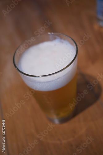 A glass of beer on a table
