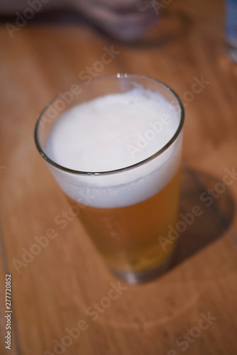 A glass of beer on a table