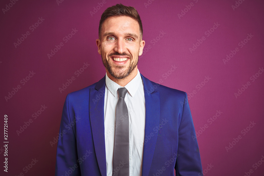 Young handsome business man over purple isolated background with a happy and cool smile on face. Lucky person. Young handsome business man over purple isolated background with a happy and cool smile on face. Lucky person.