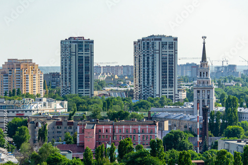 View from window of skyscraper on two modern high-rise buildings against blue sky. Right close-up most famous high-rise is building ofSouth-Eastern Railway. Voronezh, Russia, June, 2019: 