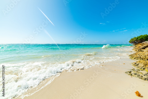 Small wave in Raisins Clairs beach in Guadeloupe