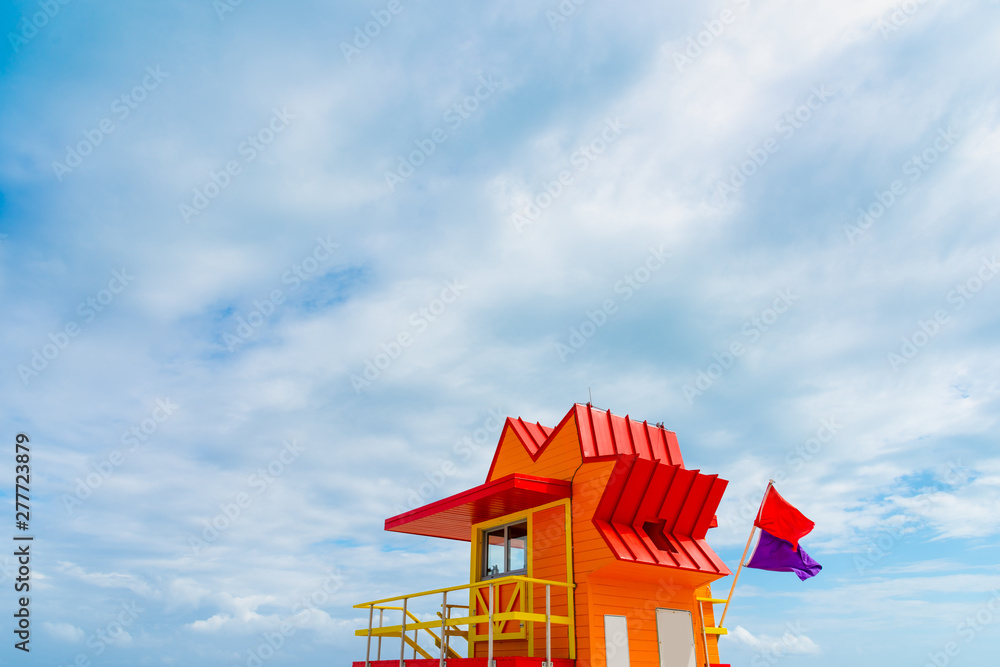 Red and Orange lifeguard tower under an overcast sky in Miami Beach Red and Orange lifeguard tower under an overcast sky in Miami Beach