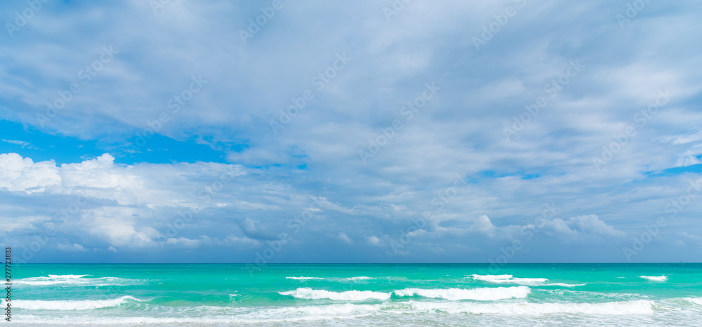 Overcast sky over Miami Beach turquoise sea