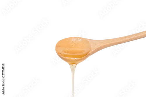 Wallpaper Mural honey dripping from wooden spoon isolated on white background Torontodigital.ca