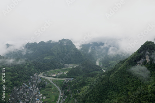 A river flows through the valley of the mountain, Aizhai, West Hunan, China