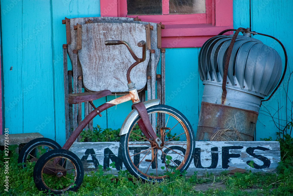antiques outside teal blue country wood building
